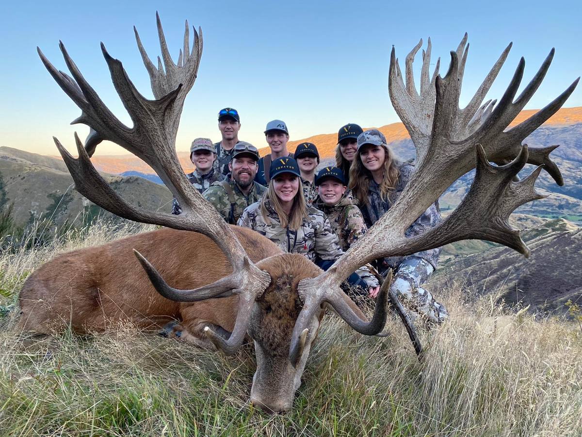 Kendra Brimhall and the whole Brimhall family with a giant red stag taken in New Zealand
