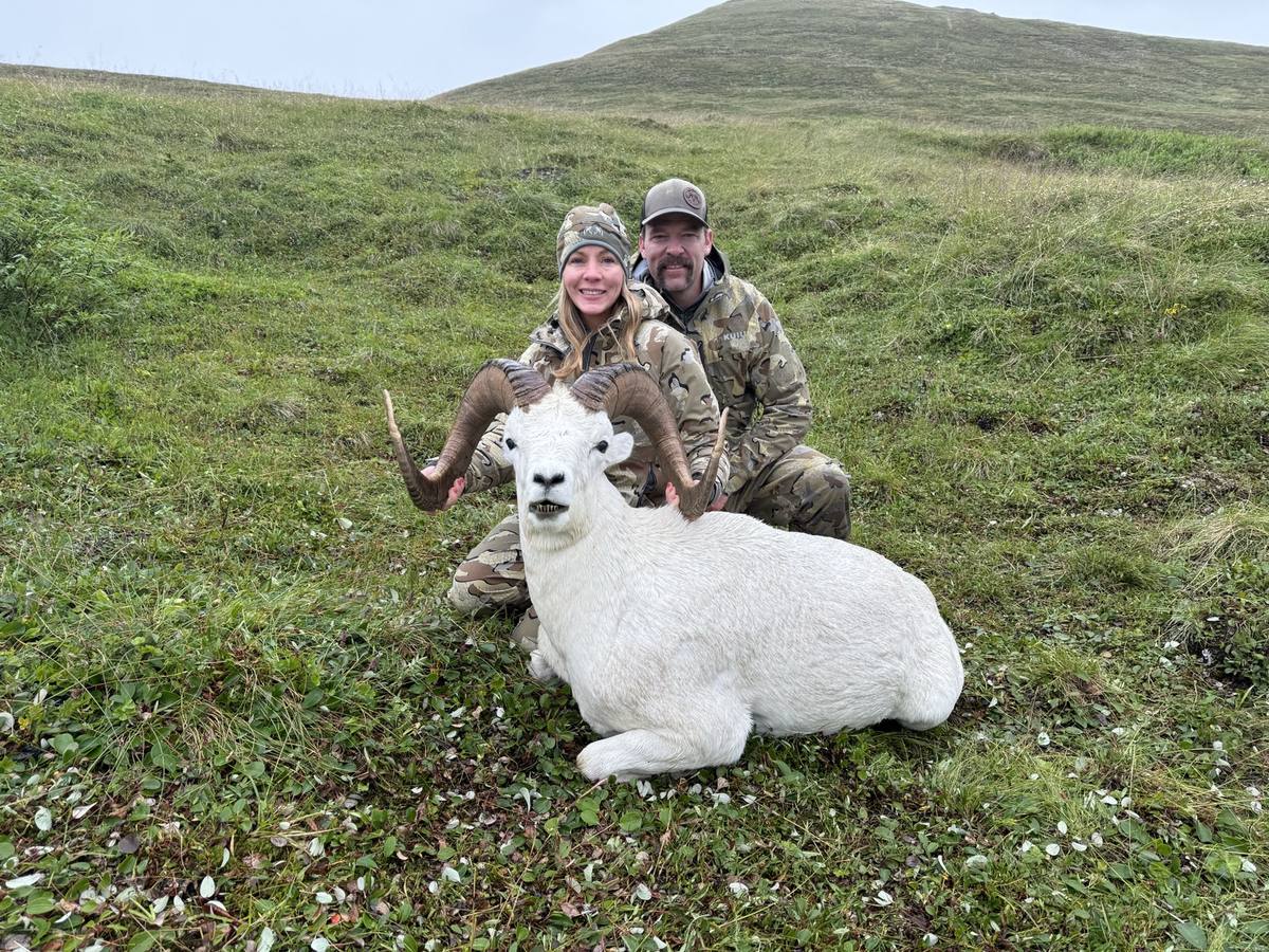 Broc and Kendra Brimhall with a 40-inch Dall sheep in the Alaska wilderness